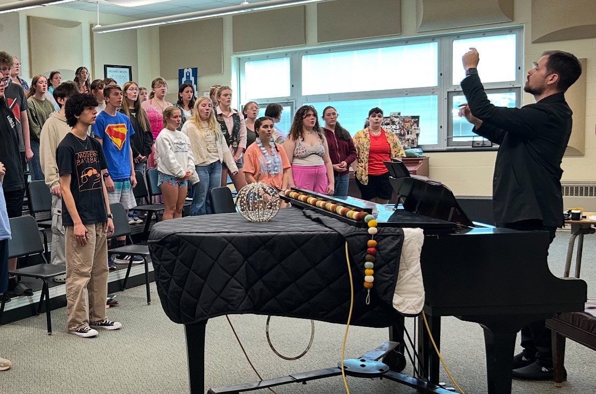 Dr. Sean Taylor works with students during a vocal clinic at the high school.
